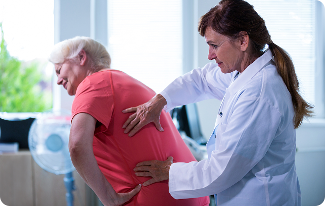 doctor checkup back pain for an old woman